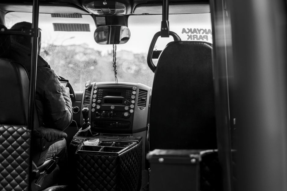 Charter bus driver being thanked and tipped by a group travel organizer