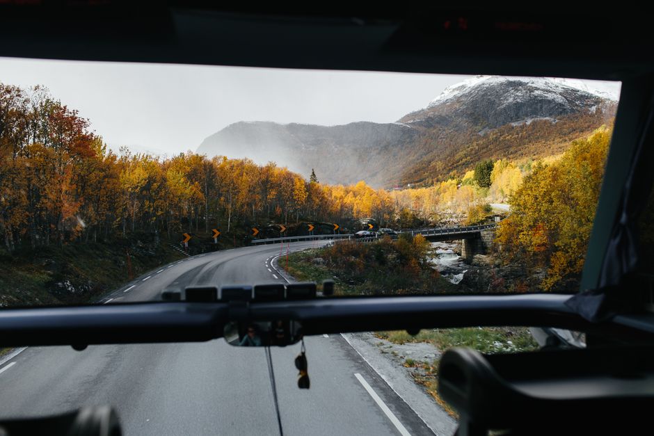 Charter bus driving down a highway during a cross-country group trip