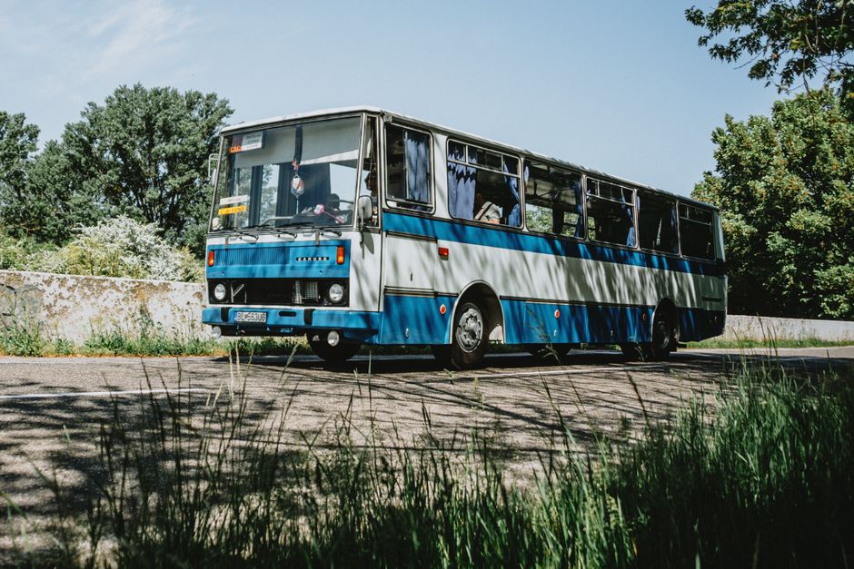Charter bus parked at a destination during a same-day return group day trip