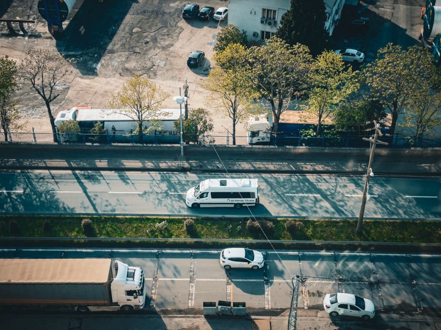 Charter bus parked on the side of a highway representing costs not included in a charter bus rental