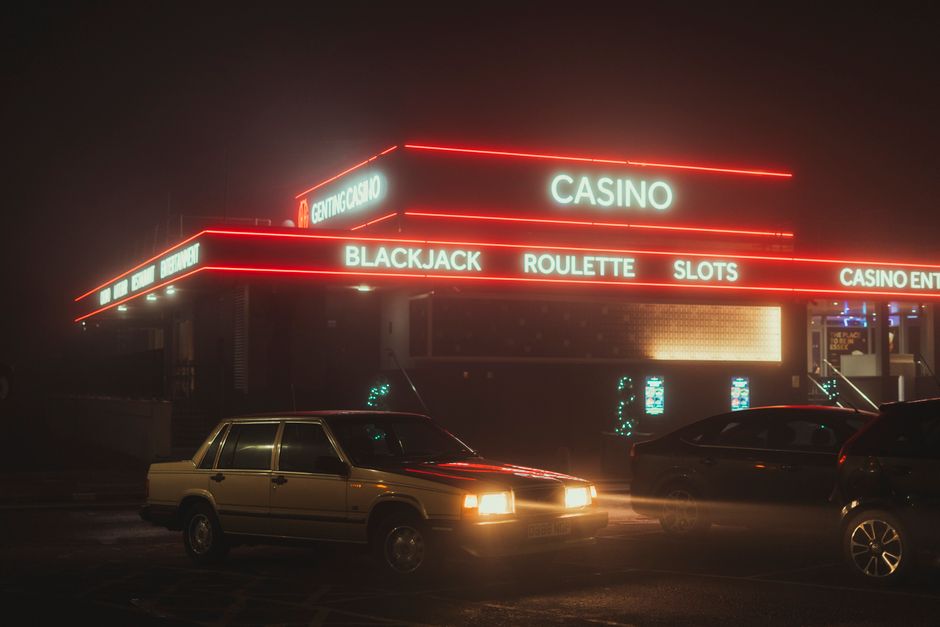 Charter bus parked outside a casino entrance for a group gambling trip