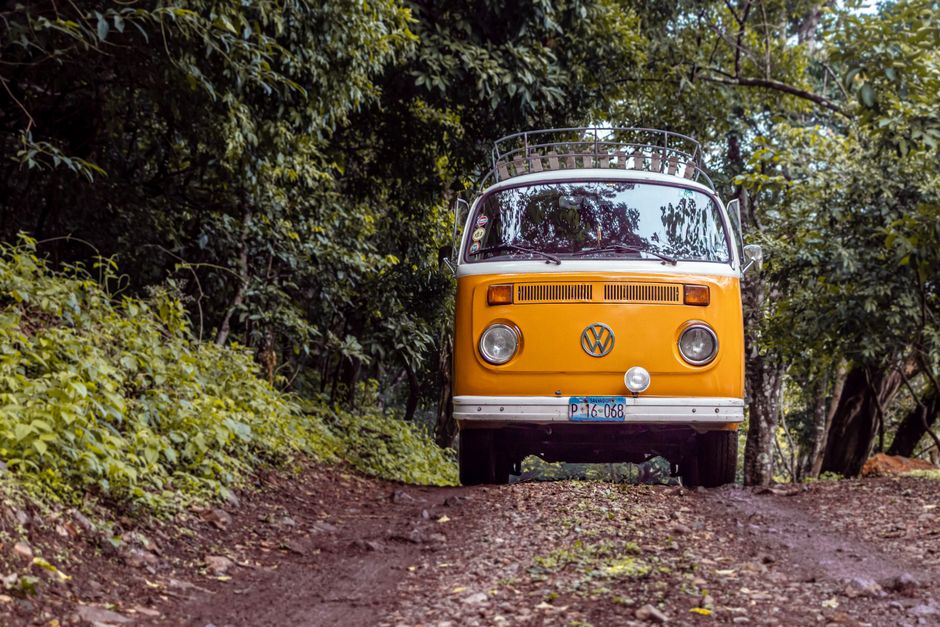 Charter bus parked outside a summer camp ready to transport campers on a field trip