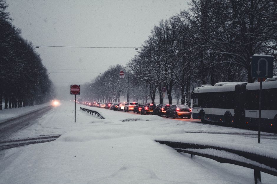 Charter bus parked outside during a snowy holiday season for group travel