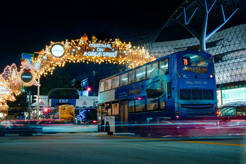 Charter bus parked outside during holiday season with passengers boarding for a group trip