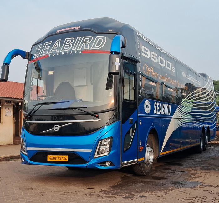 Charter bus parked outside ready to pick up a group of passengers for a discounted group trip