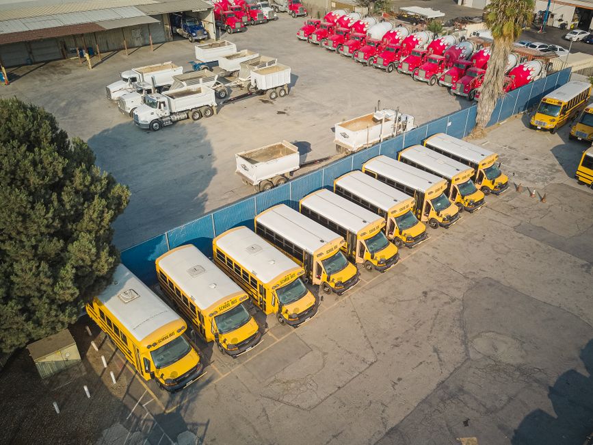 Charter bus providing employee shuttle service outside a corporate office building