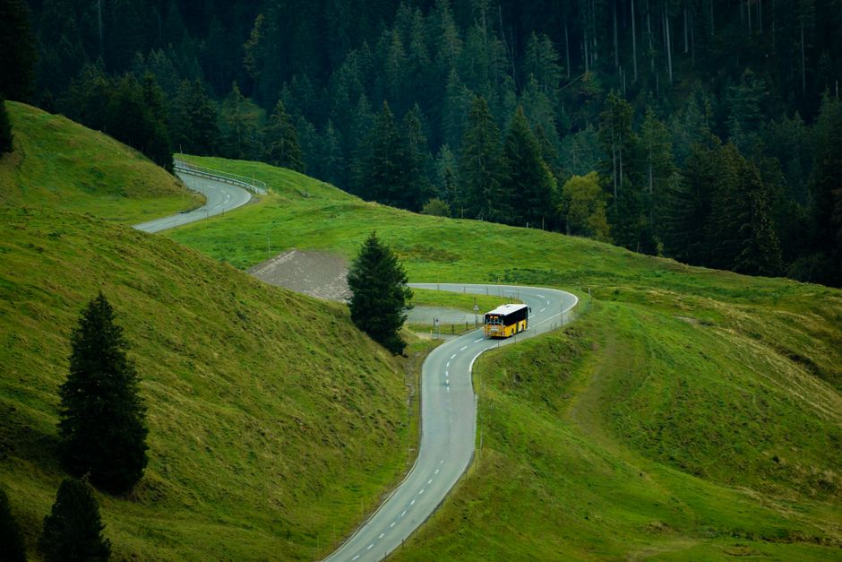 Charter bus traveling on a highway for a one-way group trip