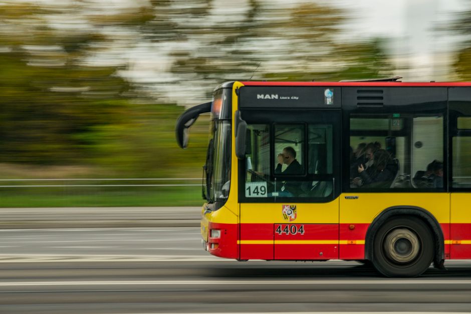 Charter bus traveling on a highway representing insurance coverage for group travel