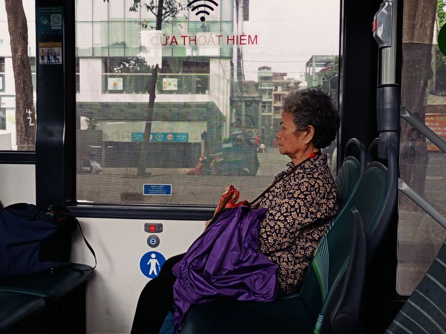 Elderly travelers boarding a comfortable charter bus with handrail assistance