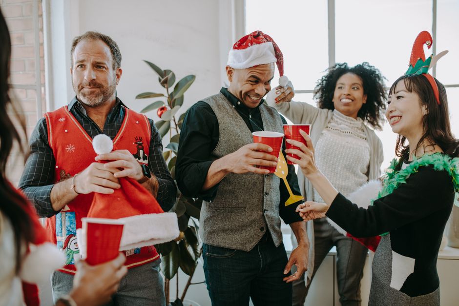 Employees boarding a charter bus for a holiday office party