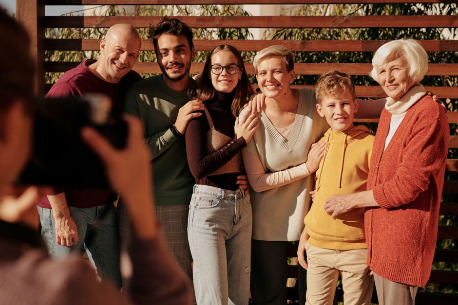 Extended family boarding a charter bus for a family reunion trip