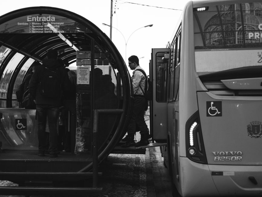 First-time passengers boarding a charter bus with luggage before a group trip