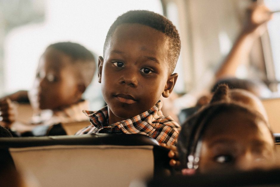 Group of children boarding a charter bus for a school field trip