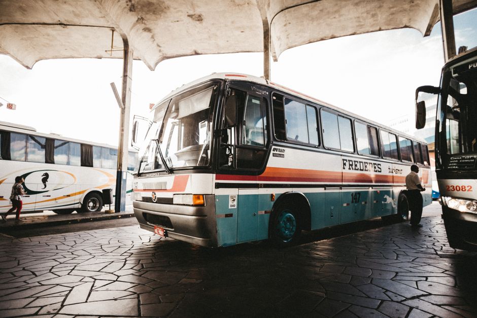 Group of senior travelers boarding an accessible charter bus for a group trip
