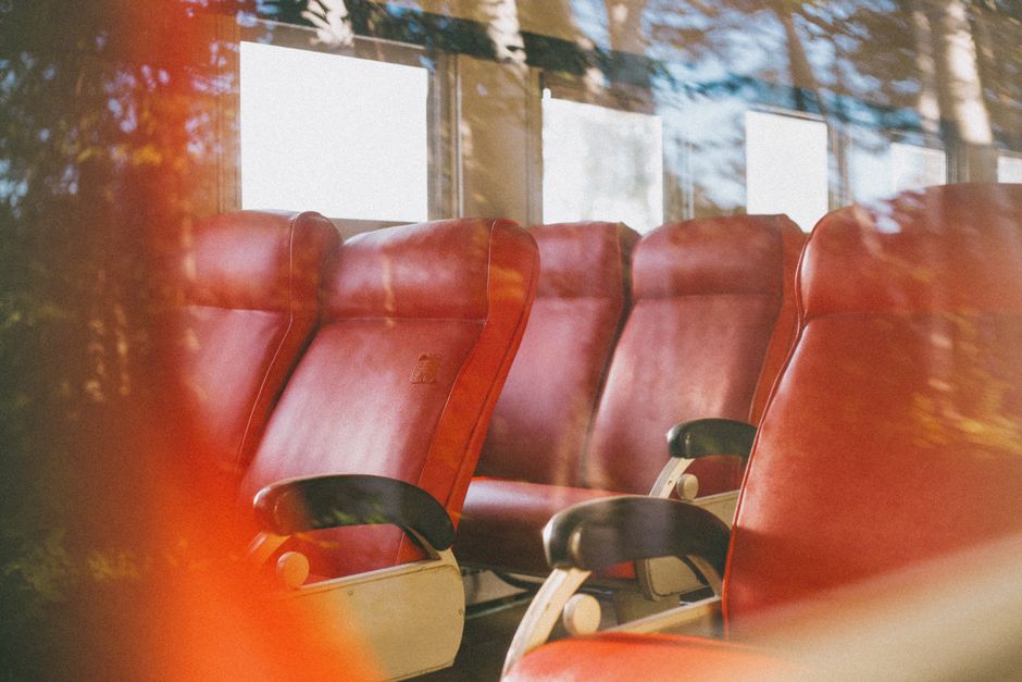 Interior view of a charter bus showing comfortable seating and onboard amenities