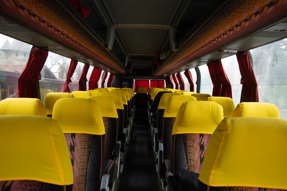 Open underneath storage compartment on a charter bus loaded with passenger luggage