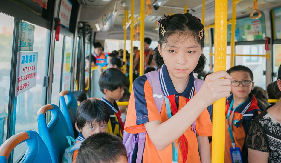 Students boarding a charter bus for a school field trip