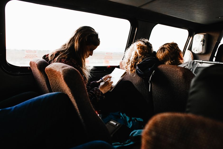 Travelers discussing questions with a charter bus company before booking their trip