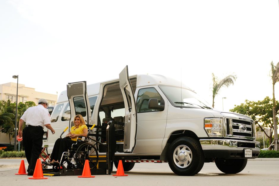 Wheelchair ramp deployed on the side of an ADA accessible charter bus