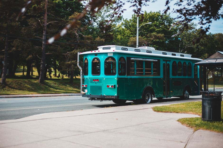 White charter bus parked and ready for passengers to board for a group trip