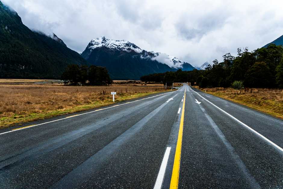 Charter bus driving along a scenic southern highway during a large group road trip