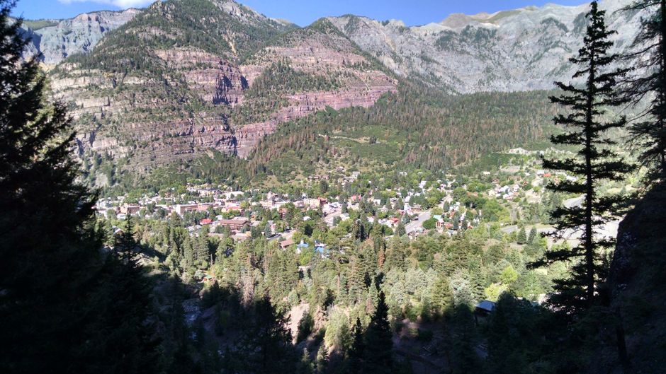 Large group of travelers admiring the scenic mountain views in Colorado